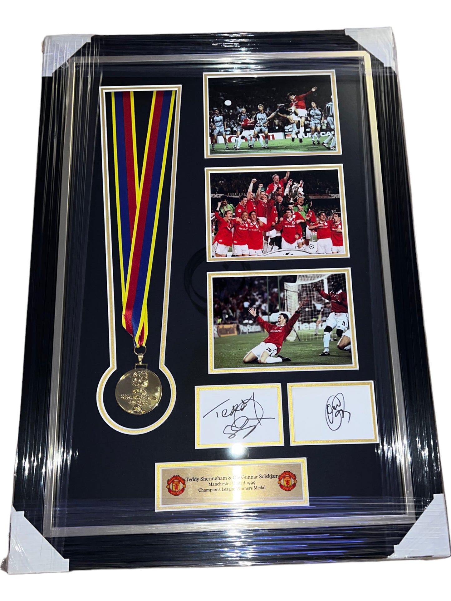 Manchester United 1999 Champions League Replica Medal signed by Teddy Sheringham and Ole Gunnar Solskjaer